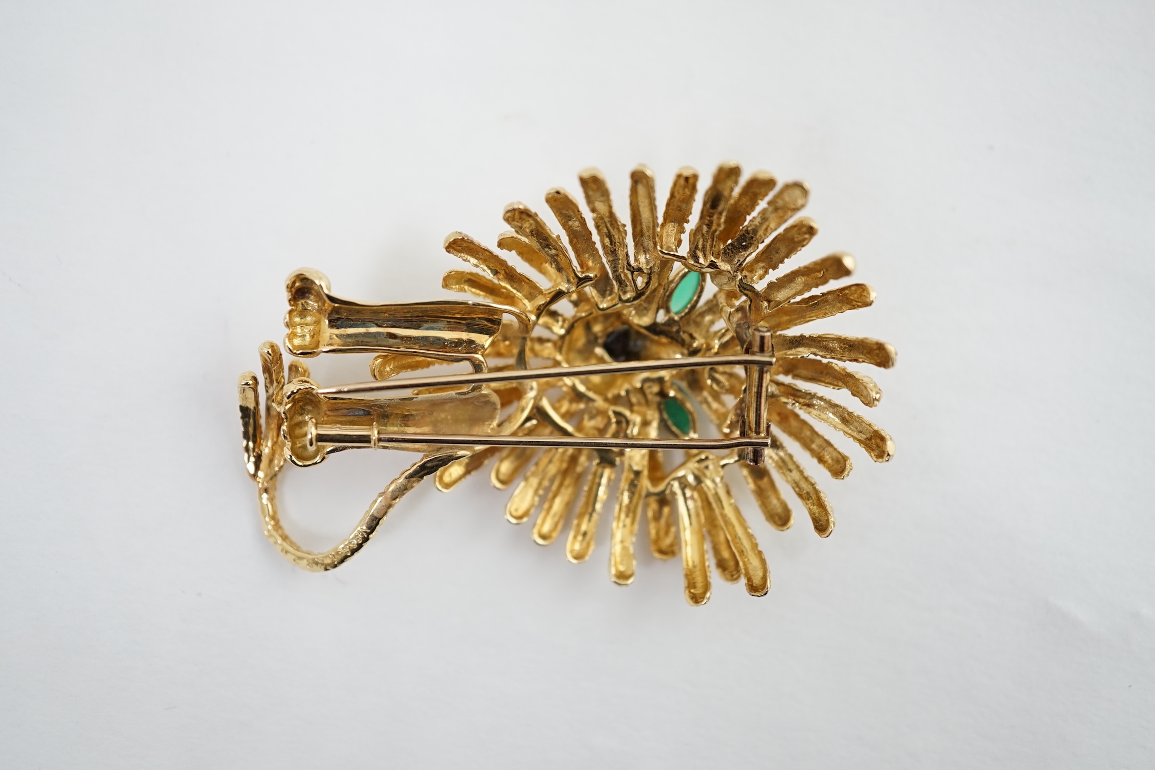 A stylised gold (tests as 18k) 'Lion King' clip brooch set chrysoprase and black enamel